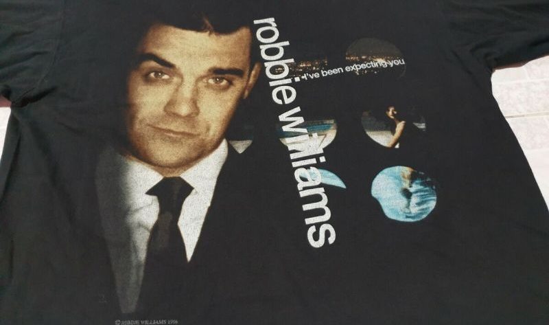 Discovering the Hidden Gems of Robbie Williams Official Shop: Collector's Edition